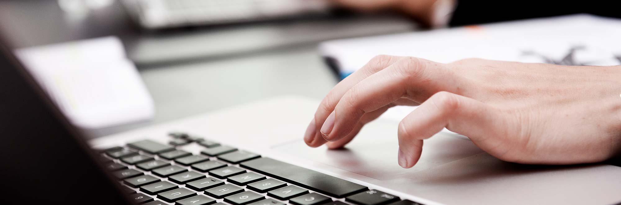 CBS hand on a computer touch pad